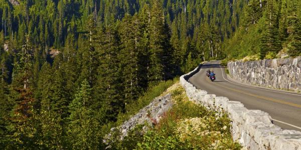 Two motorcyclists out for a ride in the mountain roads of Mount Rainier National Park.